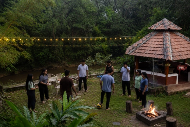 Families and friends enjoying an evening at Streamedge Sakleshpur