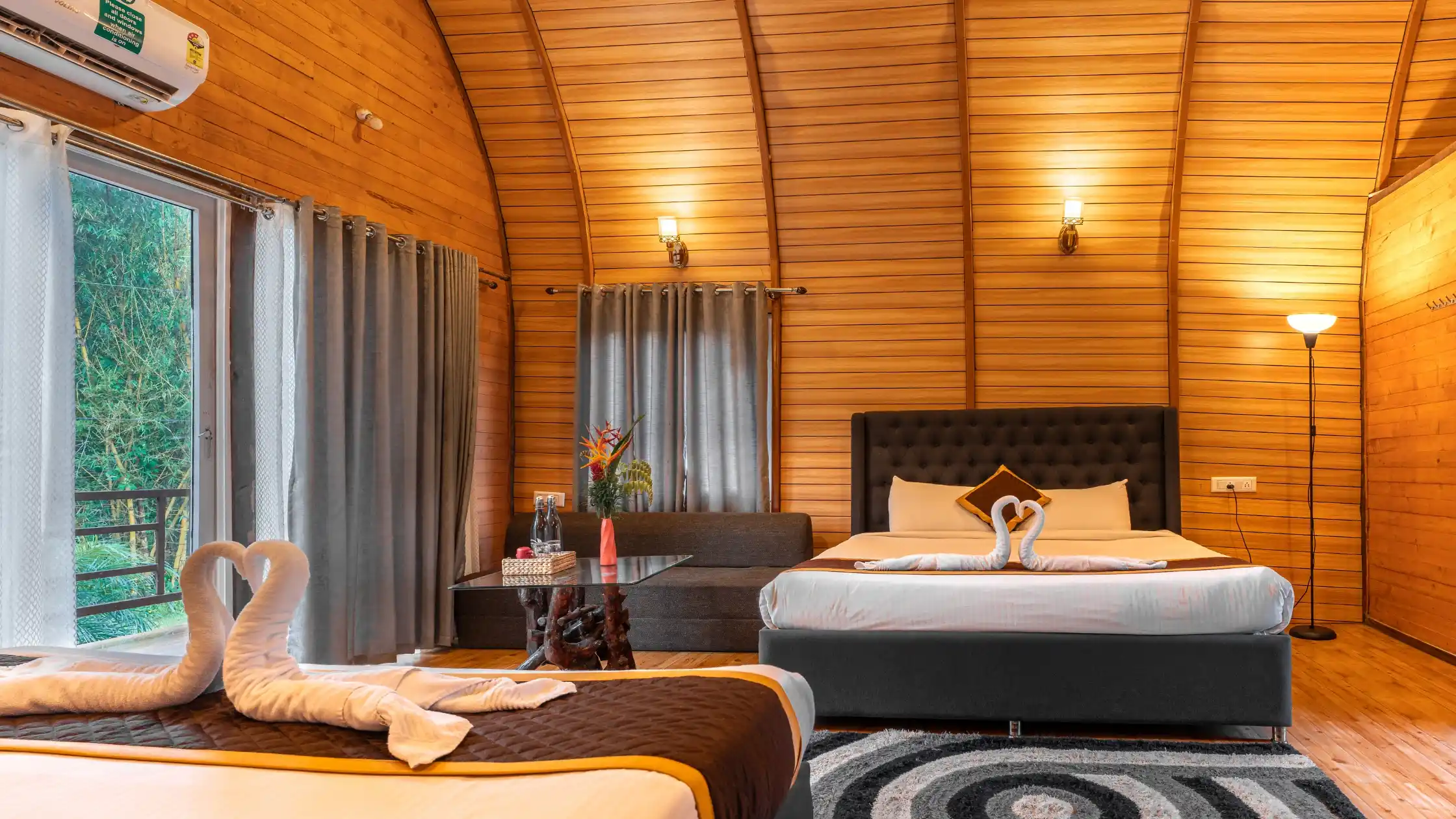 Wooden Cottage Bedroom with Modern Resort Amenities in Sakleshpur